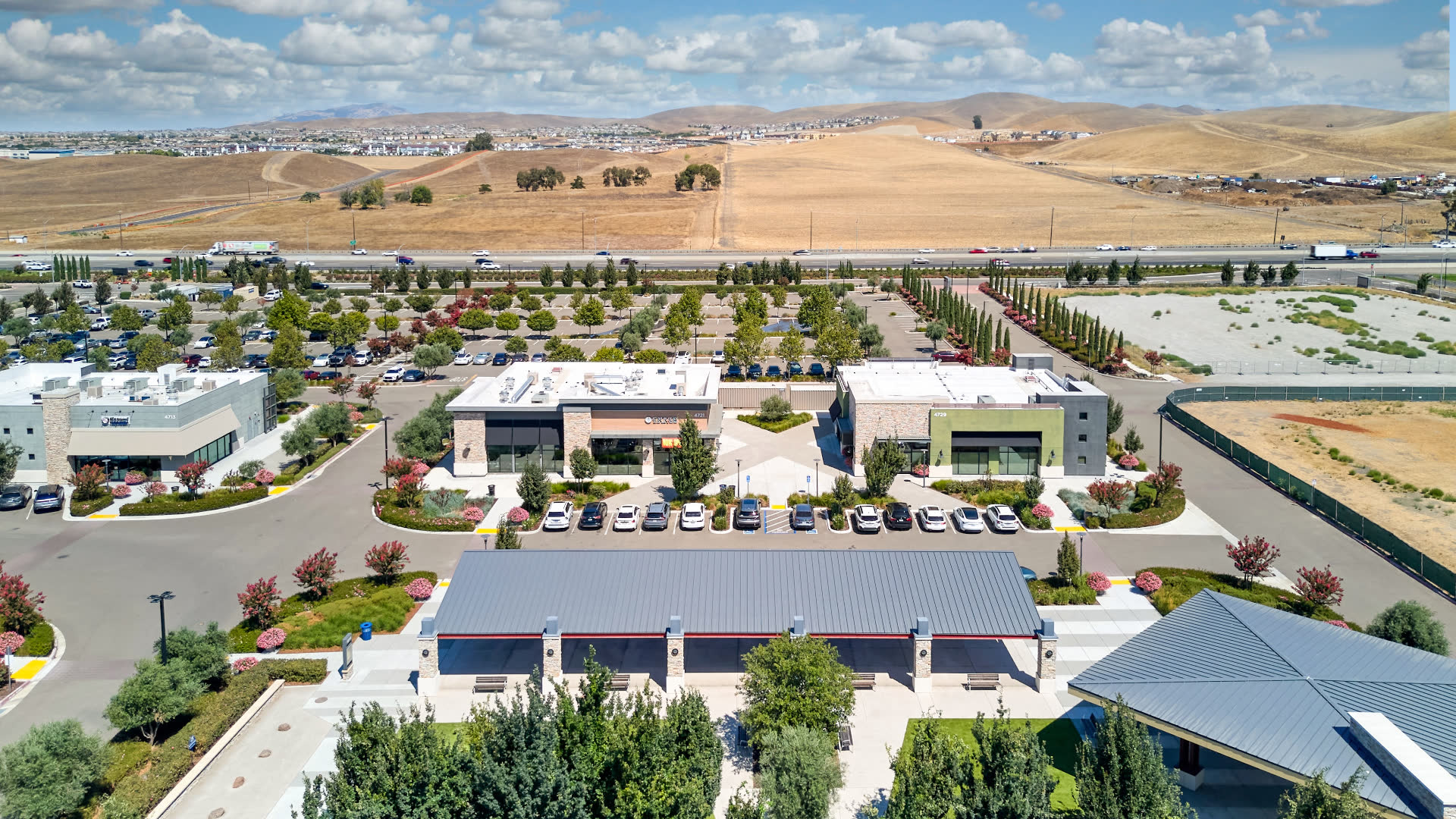 Rear retail buildings at Republic Square with Altamont Hills